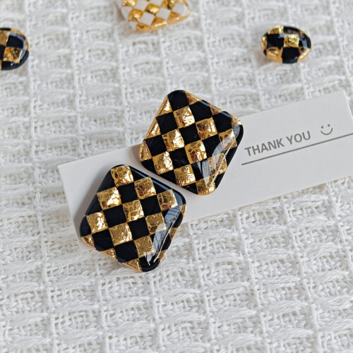 checkerboard gold stud earrings product display