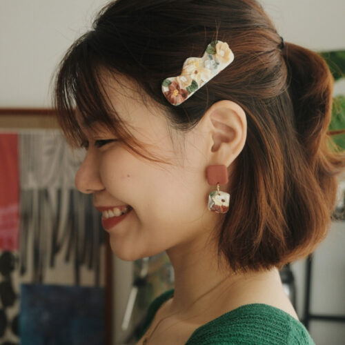 Terracotta Garden polymer clay square drop earrings worn on model – handmade floral jewelry with terracotta tones